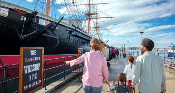 Family walking towards HMS Warrior