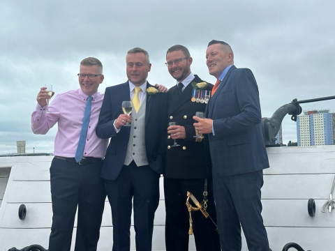 Grooms and best man on HMS Warrior wedding