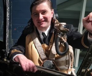 Man stood over a swordfish aircraft