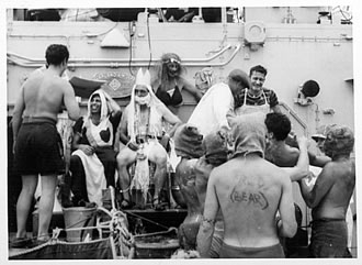 Poseidon sits atop a ship surrounded by crew