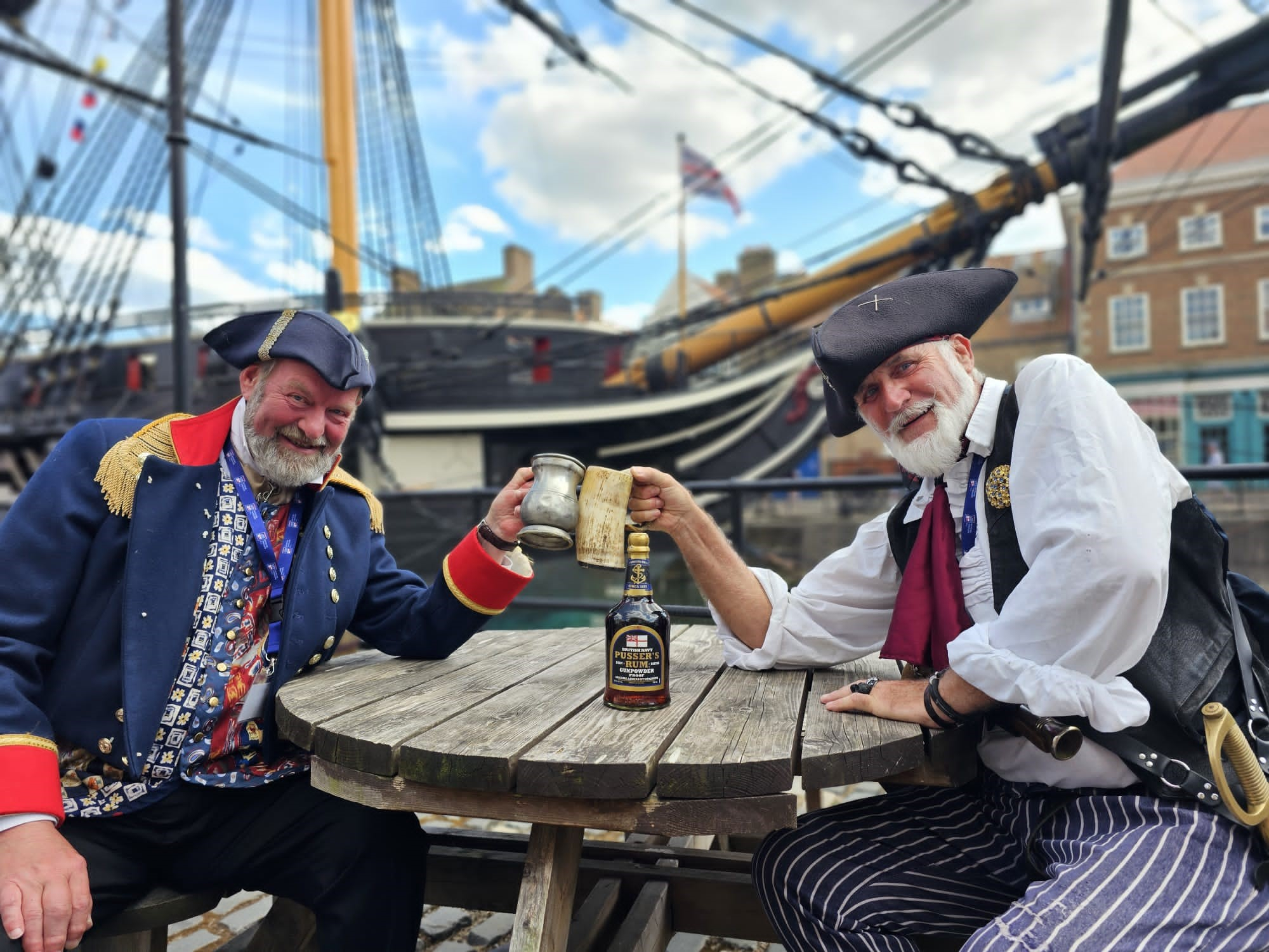 Two pirates drink rum in front of HMS Trincomalee in Hartlepool