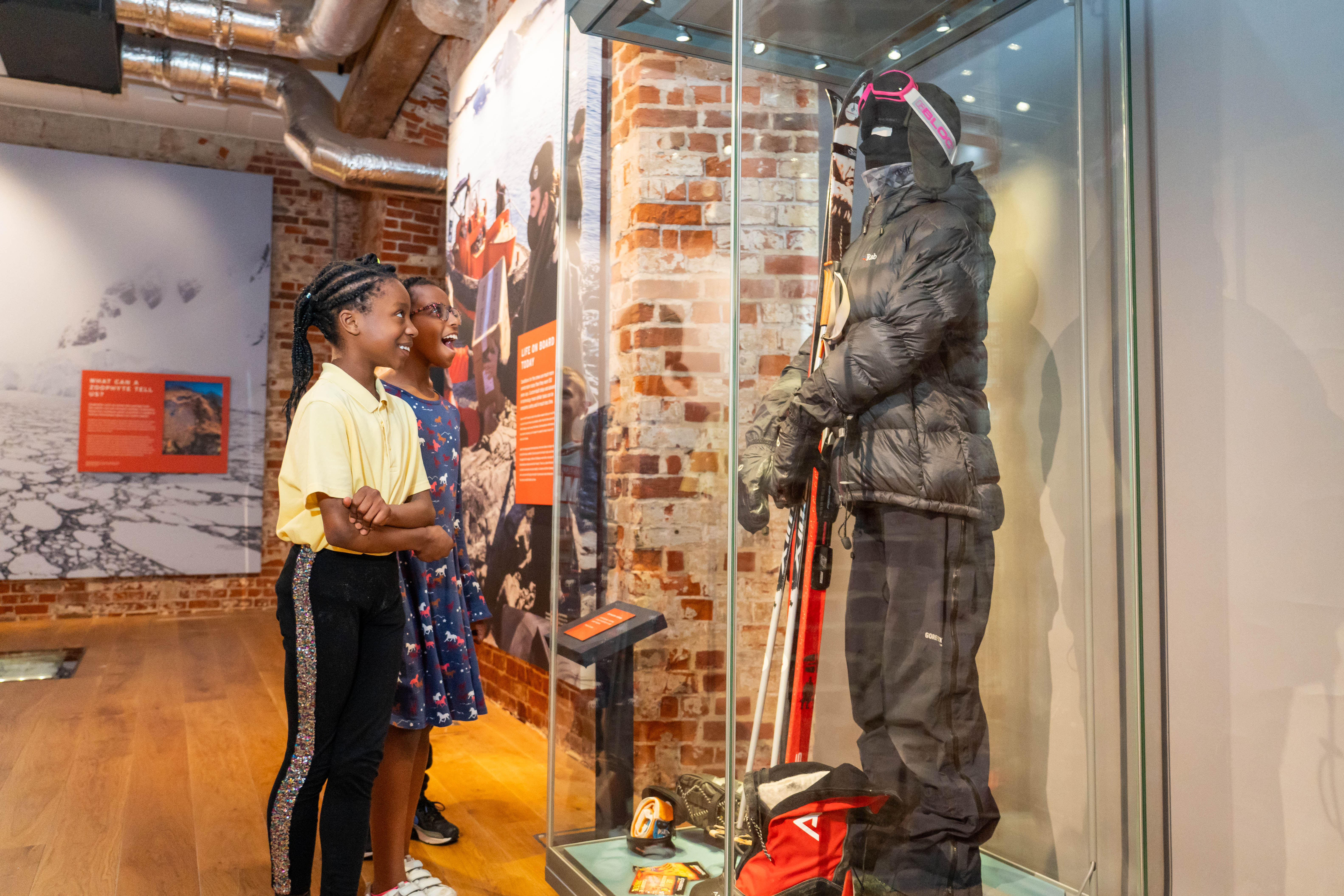 Two children look at a display in the Worlds Beneath the Waves exhibition