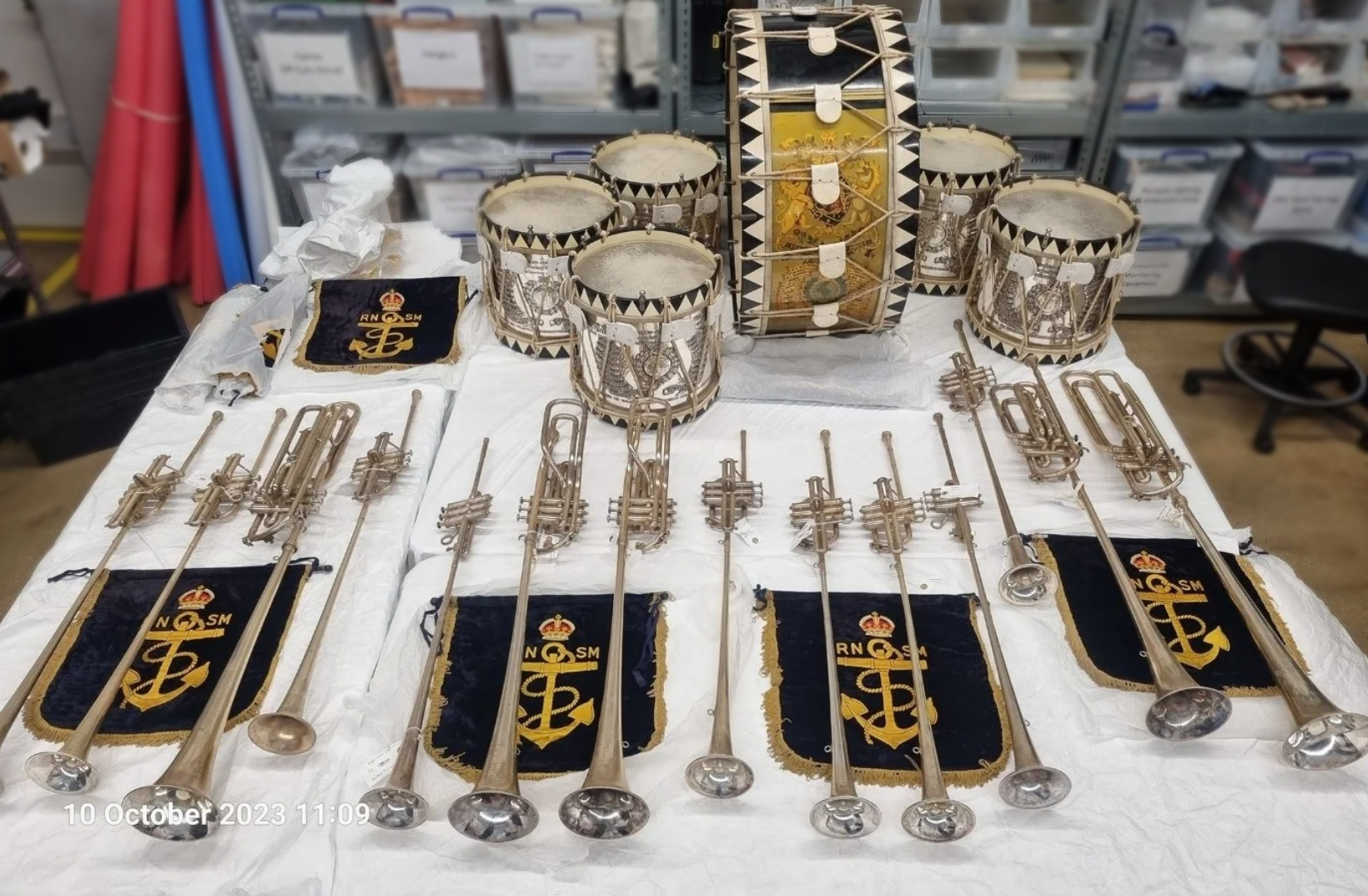 A beautifully made set of brass instruments of the Royal Marines Band Service.
