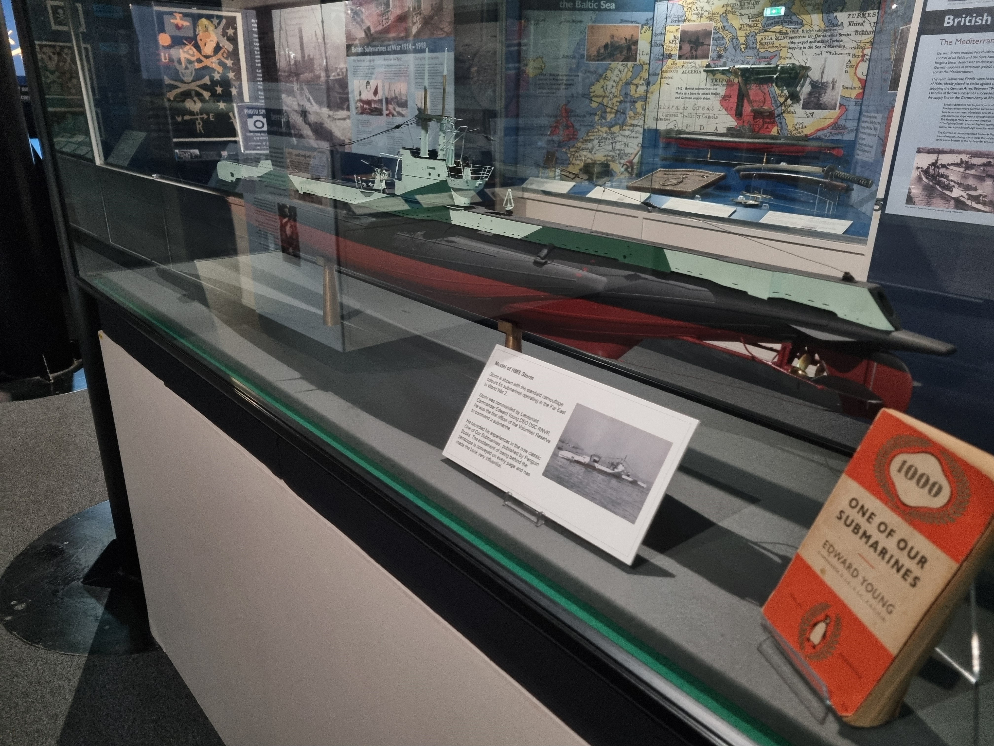 A model submarine and a book on display at the Royal Navy Submarine Museum in Gosport