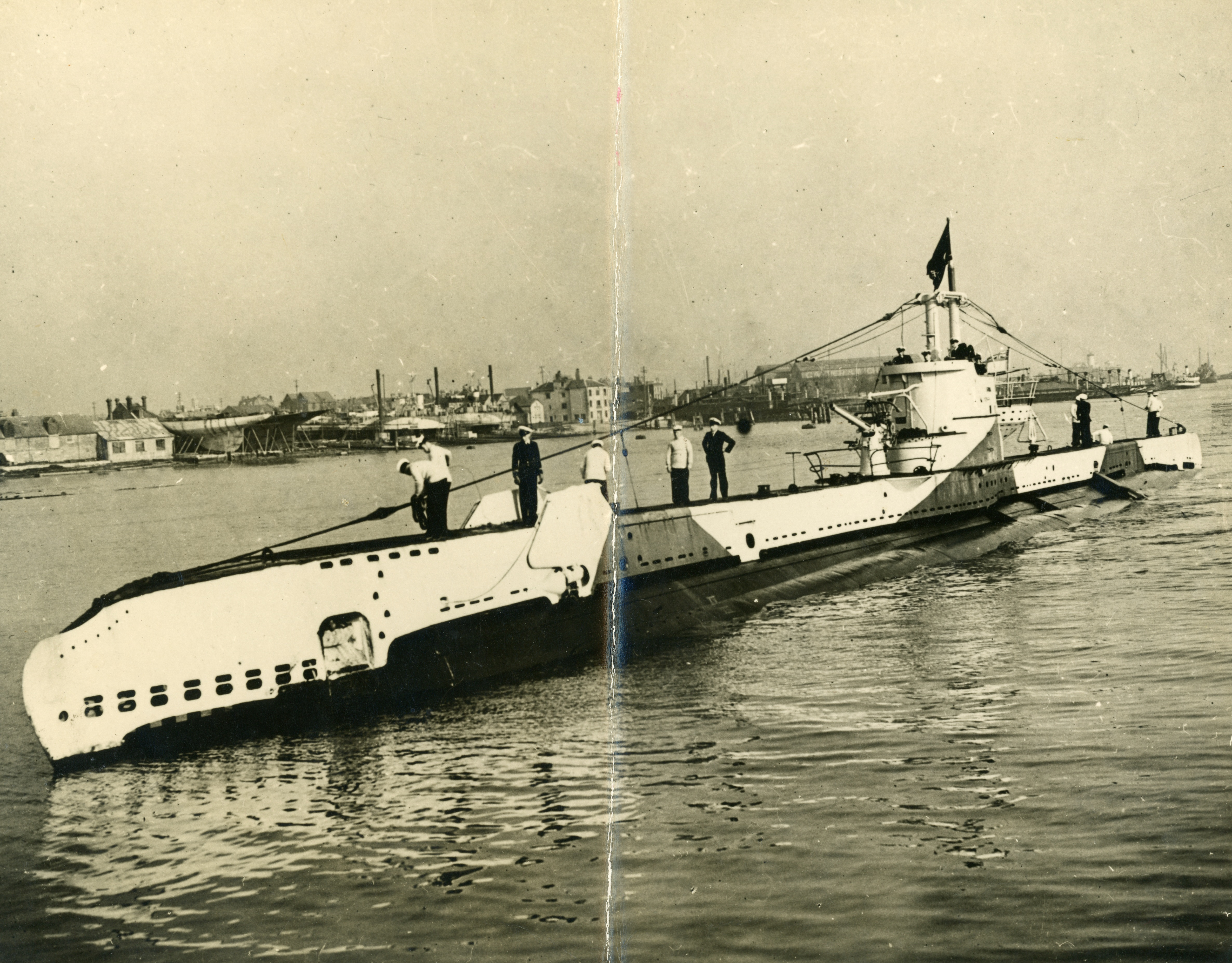 A black and white photo of a Second World War-era camouflaged submarine