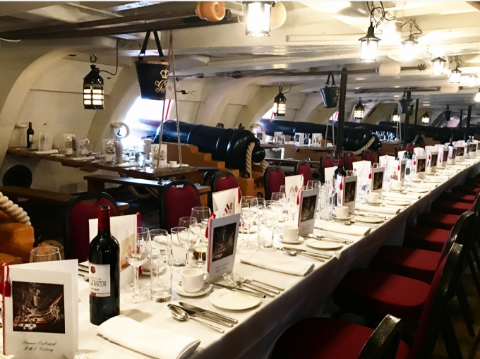 Lower Gun Deck long dining table set up for private dinner