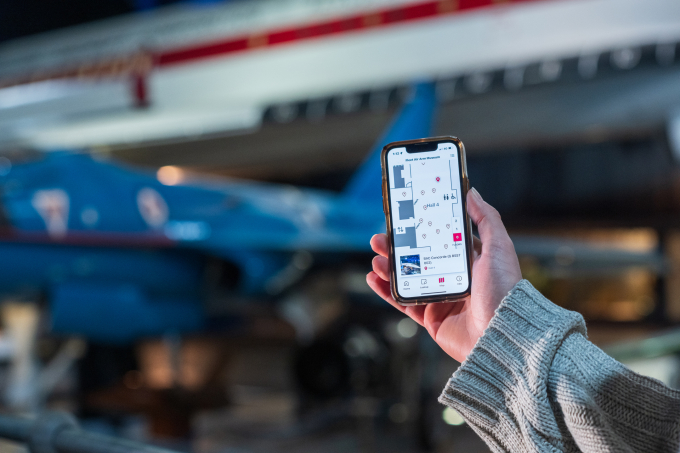 Phone showing information with Concorde behind