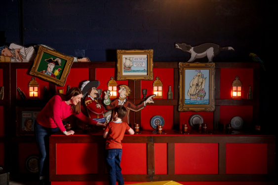 A mother and young son enjoy the Horrible History display.