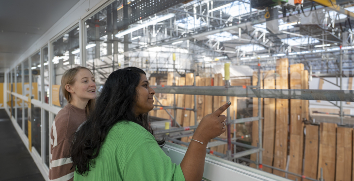 2 women onboard Victory Live looking at the conservation works