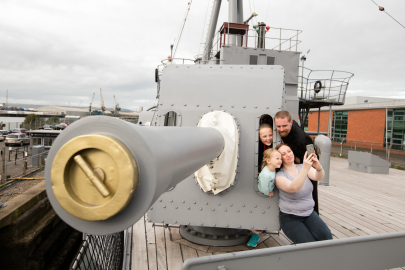 Family on top deck of HMS Caroline