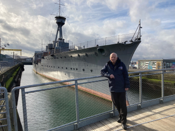 John Taylor alongside HMS Caroline