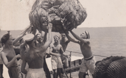 Eight men unloading 99 bags of mail at Colombo.