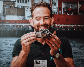 man holding sea creature