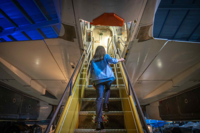 Girl walking up stairs into Concorde 002