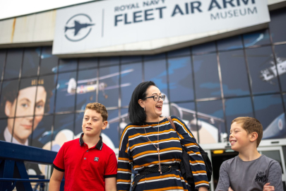 family smiling outside of Fleet Air Arm Museum
