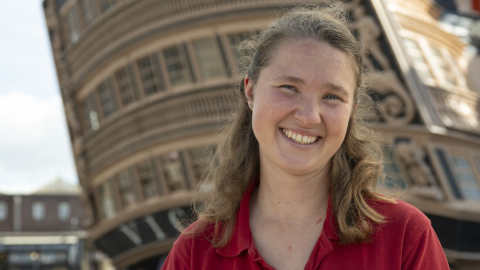 Dinnie Jay a Shipwright for the National Museum of the Royal Navy stood in front of HMS Victory