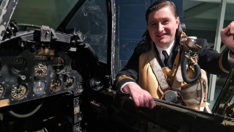 Man stood over a swordfish aircraft