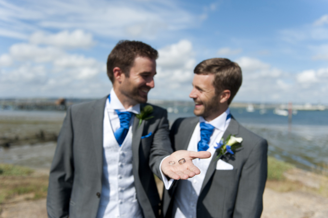 Same sex couple posing for photos on Camber Basin Gosport