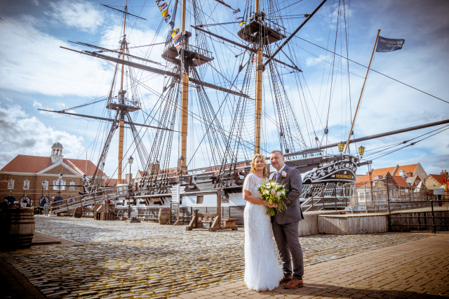 Wedding couple standing on quayside