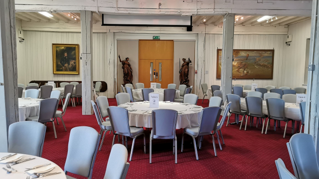 Princess Royal Gallery set up with round tables for luncheon