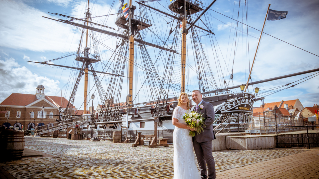 Wedding couple standing on quayside