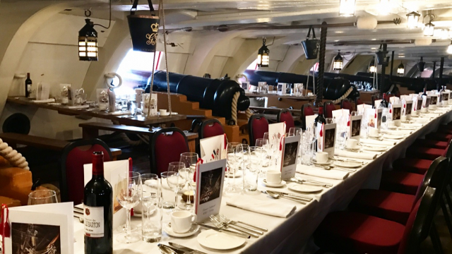 Lower Gun Deck long dining table set up for private dinner