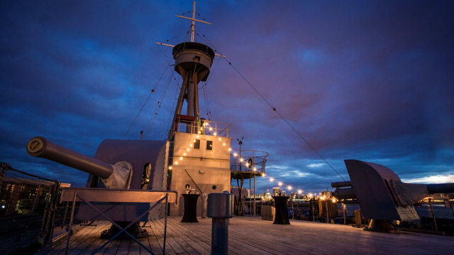 Evening shot with fairy lights on main deck HMS caroline