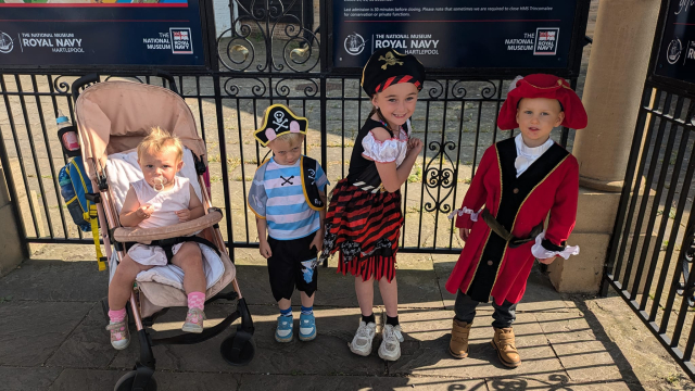 Group of kids for a pirate party wearing a pirate hat