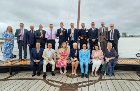 Wedding party on top deck of HMS Warrior