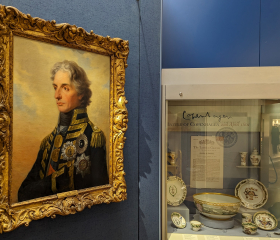 A gallery space featuring a 3/4 angle painting of Vice Admiral Lord Horatio Nelson