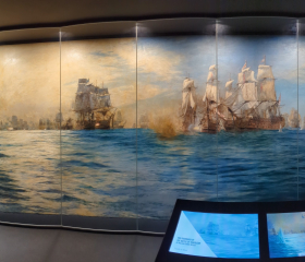 A panoramic photograph of a large naval battle painting
