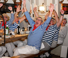 Table of people cheering