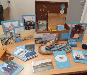 A chatterbox open on a table with its contents on display