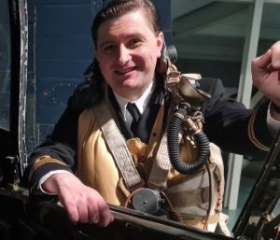 Man stood over a swordfish aircraft