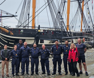 Members of the Royal Navy’s Race Diversity Network with Principal Curator Clare Hunt alongside HMS Trincomalee