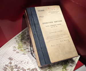 One of the original Operation Neptune naval orders in a case at the National Museum of the Royal Navy