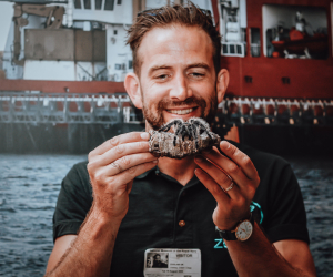 man holding sea creature