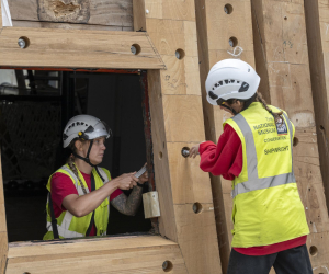 Two shipwrights working on Gunport of HMS Victory Renovation
