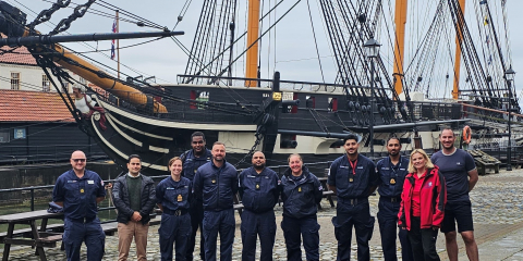 Members of the Royal Navy’s Race Diversity Network with Principal Curator Clare Hunt alongside HMS Trincomalee