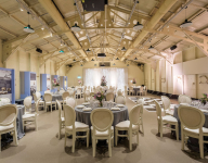 Round table set up on HMS Caroline Drill Hall